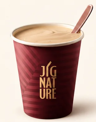 Classic Jigarthanda in a burgundy JiGNature cup with a smooth creamy top