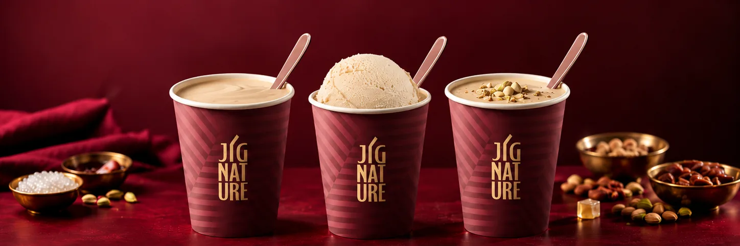 Classic, Special and Premium Jigarthanda in JiGNature cups on a burgundy table