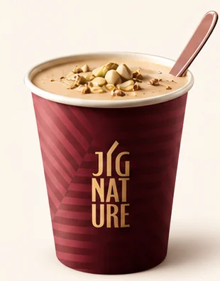 Premium Jigarthanda in a JiGNature cup topped with nuts